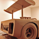 Image for article titled Artist Builds Amazing Vintage Racer From Cardboard And Hot Glue